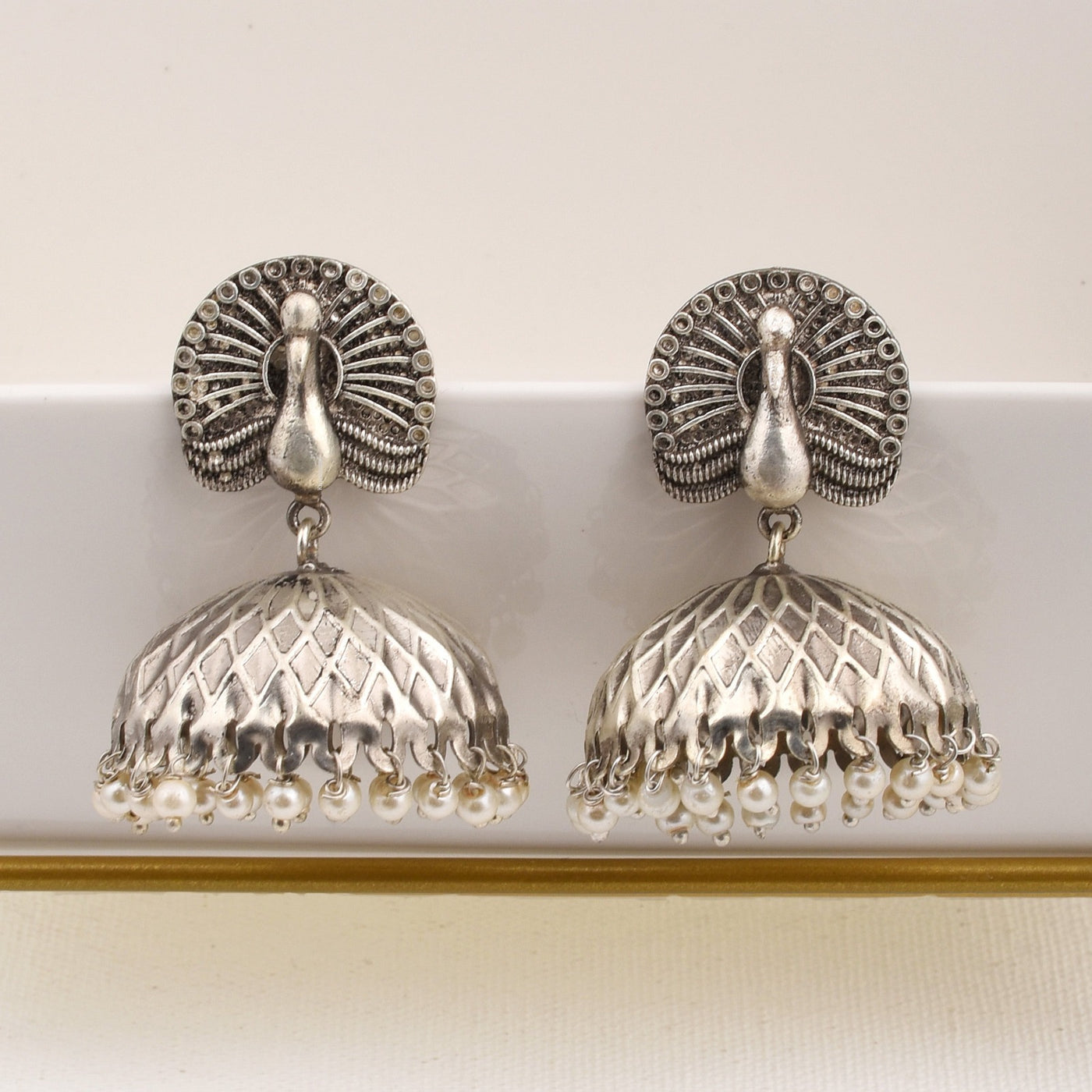 Vyom Peacock shaped Silver Look Alike Jhumka